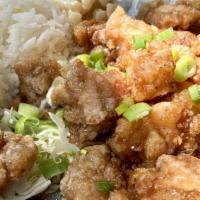 Popcorn Chicken · Small nuggets of chicken thighs fried in a light, crispy breading.