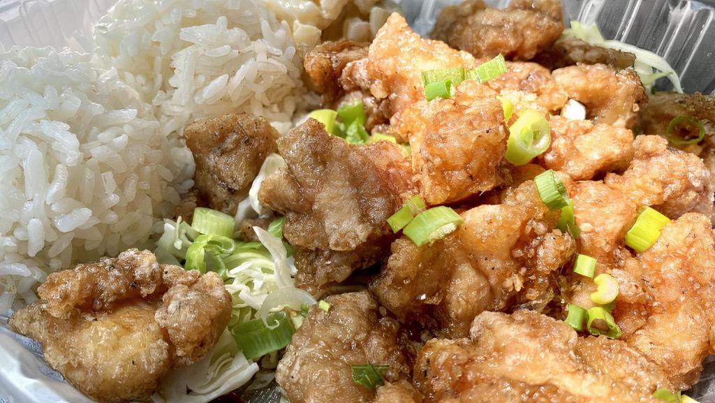 Garlic Chicken · Chicken thigh pieces fried in a light crispy breading and tossed in special garlic sauce.  Served with macaroni salad and two scoops of white rice.