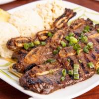 Grilled Short Ribs · Three strips of tender, center cut beef ribs marinated in Hukilau's special sauce. Served wi...