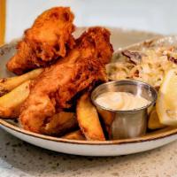 English Fish & Chips · Battered Fried Flaky Cod, French Fries,  Slaw, and Tartar Sauce.