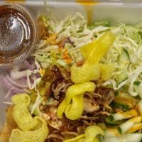 Samosa Salad · Crushed samosa, fresh cabbage, onion, yellow bean powder, fried garlic and mint with tamarin...
