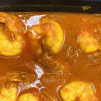 Burmese Shrimp Curry · Burmese style shrimp curry, with tomato, onion and cilantro.