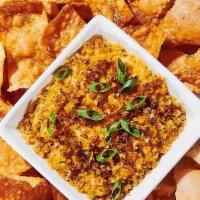 Creole Shrimp Dip · Melted cheese, cajun butter, green onions, side of wonton crisps