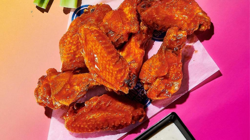 Original Wings · Your choice of sauce or dry rub. Served with celery, carrot sticks, and choice of Ranch or Bleu Cheese.