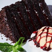 Big Daddy Chocolate Cake · Warm, gooey chocolate cake served with vanilla ice. cream topped with chocolate and raspberr...