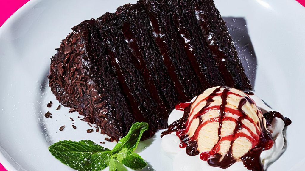 Big Daddy Chocolate Cake · Warm, gooey chocolate cake served with vanilla ice. cream topped with chocolate and raspberry topping.