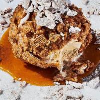 New! Cinnamon Crunch Fried Ice Cream · Cinnamon brown sugar ice cream crusted with cinnamon toast crunch cereal, finished with a dr...