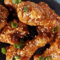 Soy Garlic Wings · Chicken wings infused with soy garlic sauce, green onions, and sesame seeds