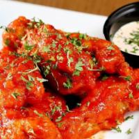 Korean Buffalo Wings · Chicken wings infused with Korean buffalo sauce, red pepper, parsely, and Japanese mayo