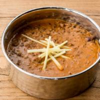 Kali Daal Makhni · Slow fire simmered black lentils with tomato, butter & garlic.