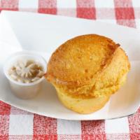 Fresh Baked Cornbread Muffin · Cinnamon-honey butter.
