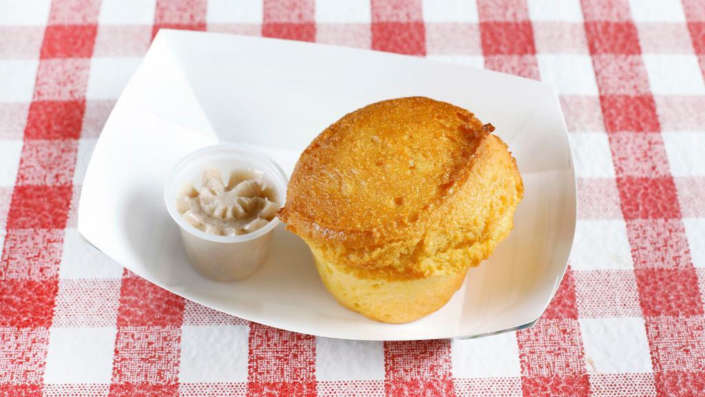 Fresh Baked Cornbread Muffin · Cinnamon-honey butter.