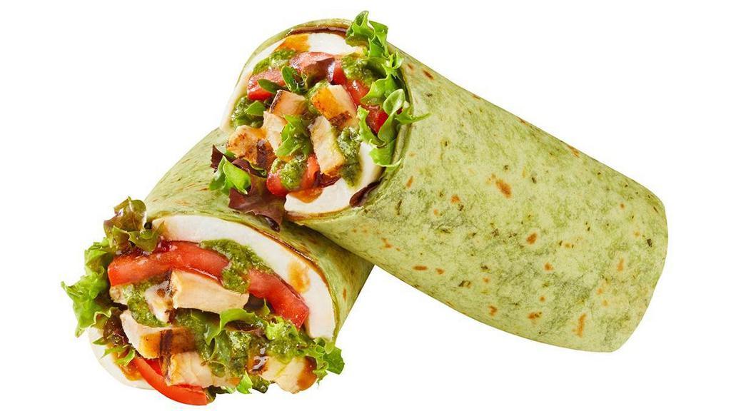 Caprese Chicken Wrap · 1/4 lb. of our all-natural, rotisserie-style chicken with melted mozzarella, fresh spring mix, and sliced tomatoes, all drizzled with a basil pesto sauce and balsamic dressing in a spinach tortilla