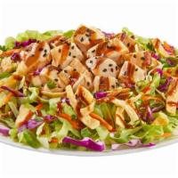 Asian Chicken Salad · Carrots, cabbage, green onions, cilantro, wonton strips, sesame seeds & our famous dressing