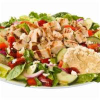 Mediterranean Chicken Salad · Grilled chicken, hummus, feta, roasted red bells, tomatoes, red onions & balsamic dressing