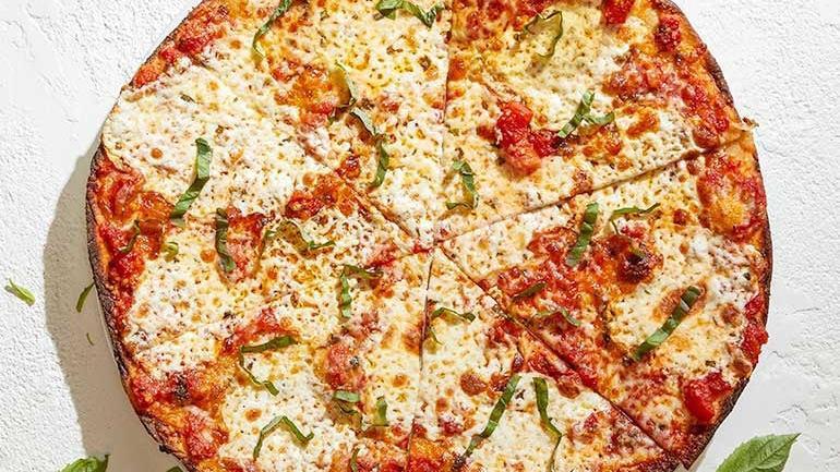Margherita · Crushed tomatoes with fresh Mozzarella, fresh basil and Parmesan.. [Calories listed are per slice. All pizzas are 6 slices.]