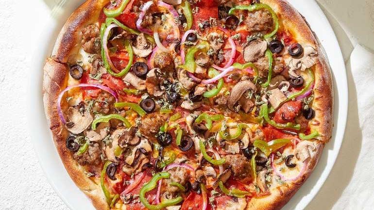 The Works · Spicy Italian sausage, rustic pepperoni, Cremini mushrooms, Mozzarella, red onions, green peppers, olives and wild Greek oregano.. [Calories listed are per slice. All pizzas are 6 slices.]
