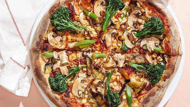 California Veggie · Broccolini, eggplant, Cremini mushrooms, sun-dried tomatoes, roasted corn, red onions and Mozzarella.  Also available with goat cheese.. [Calories listed are per slice. All pizzas are 6 slices.]