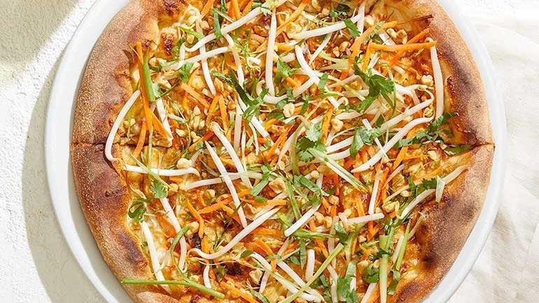 Thai Chicken · Thai peanut sauce and Mozzarella, hearth-baked then topped with crisp bean sprouts, julienned carrots, slivered scallions and fresh cilantro.. [Calories listed are per slice. All pizzas are 6 slices.]