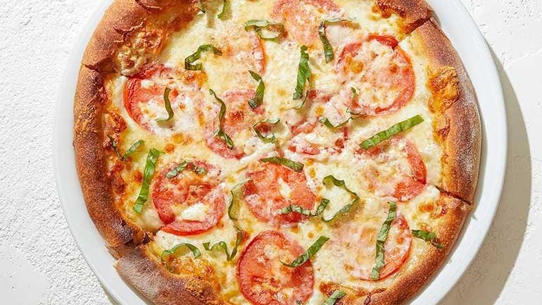 Five Cheese + Fresh Tomato · Fresh and traditional Mozzarella, Monterey Jack, smoked Gouda and Romano with tomato and fresh basil.. [Calories listed are per slice. All pizzas are 6 slices.]