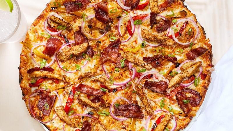 Jamaican Jerk Chicken · Spicy sweet Caribbean sauce, authentic Jamaican spices, Nueske's applewood smoked bacon, red onions, bell peppers and scallions.. [Calories listed are per slice. All pizzas are 6 slices.]