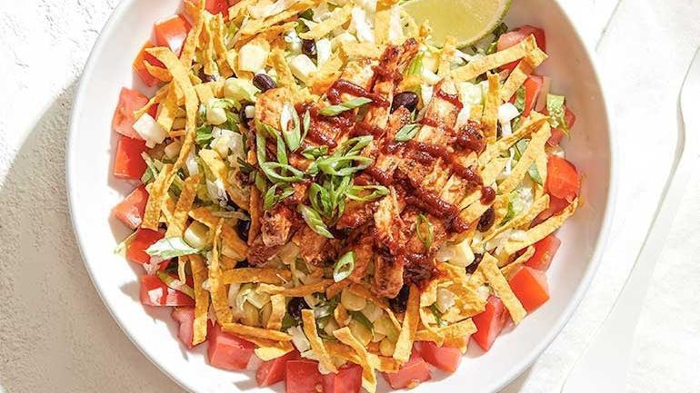 Catering The Original Bbq Chicken Chopped Salad · Black beans, sweet corn, jicama, fresh cilantro & basil, crispy corn tortilla strips, and Monterey Jack. Topped with BBQ chicken, tomatoes and scallions, served with our legendary BBQ sauce and housemade herb ranch. Also available with fresh avocado.