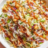Catering Thai Crunch Salad · Crisp veggies and fresh cilantro with chicken and the crunch of peanuts, wontons and rice st...