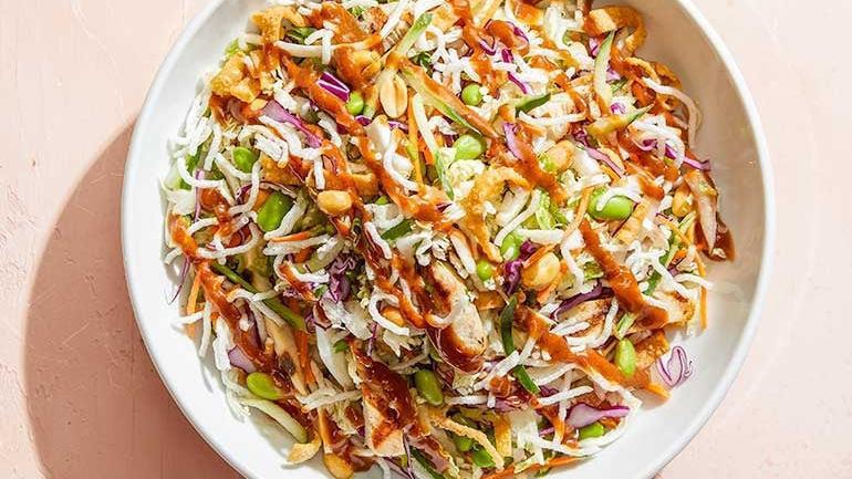 Catering Thai Crunch Salad · Crisp veggies and fresh cilantro with chicken and the crunch of peanuts, wontons and rice sticks. Served with Thai peanut dressing. Also available with fresh avocado.