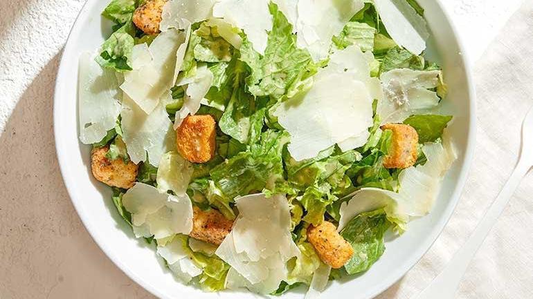 Catering Classic Caesar Salad · Crisp Romaine with shaved Parmesan and housemade garlic butter croutons. Also available with grilled chicken, shrimp, or sautéed salmon.
