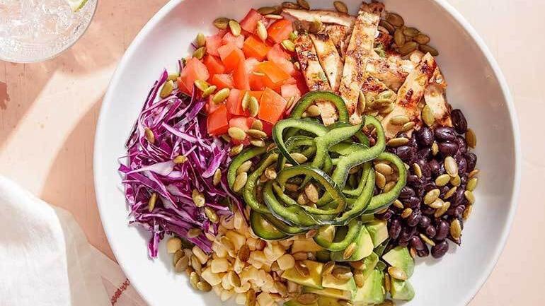 Santa Fe Power Bowl · Cilantro farro and spinach topped with lime chicken, tomatoes, sweet corn, black beans, red cabbage, fresh avocado, poblano peppers and toasted pepitas. Served with housemade poblano ranch on the side.