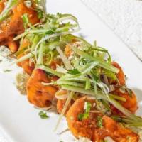 Spicy Buffalo Cauliflower · Fresh cauliflower florets buttermilk-battered and lightly fried, then tossed in housemade Sr...