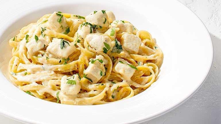 Catering Garlic Cream Fettuccine · Our garlic Parmesan cream sauce with fresh Italian parsley. Also available with chicken, shrimp, chicken & shrimp and/or sautéed Cremini mushrooms.