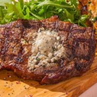 Fire-Grilled Ribeye* · 12oz USDA choice ribeye grilled with housemade Pinot Noir sea salt and topped with bleu chee...