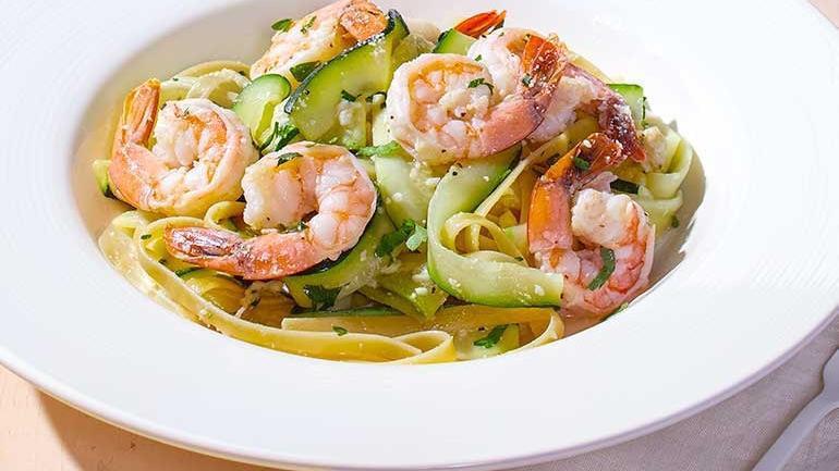 Shrimp Scampi Zucchini  · Our lighter spin on a traditional recipe. Zucchini ribbons sautéed with lemon, garlic and white wine, tossed with fresh Italian parsley, Parmesan and a touch of fettuccine.