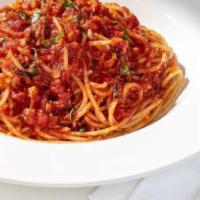 Tomato Basil Spaghetti · With sautéed garlic and fresh basil.