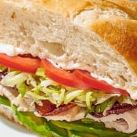 Turkey California Club Sandwich · Oven-roasted turkey with fresh avocado, Nueske's applewood smoked bacon, crisp Romaine and t...