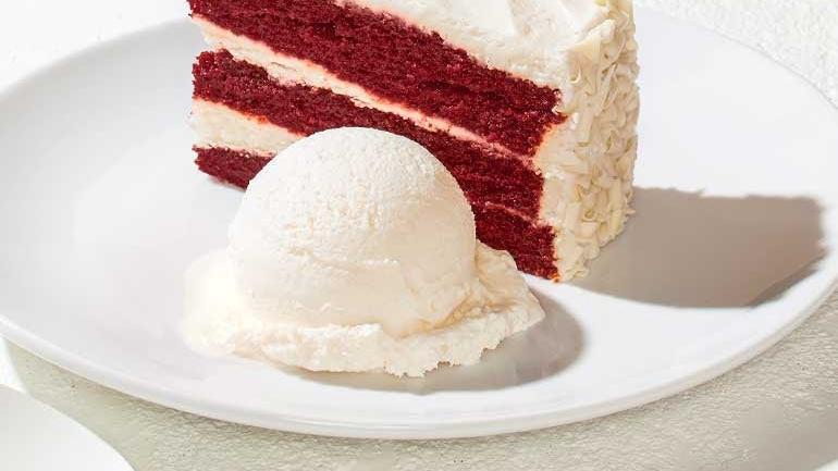 Red Velvet Cake · Frosted with hand-whipped vanilla bean cream cheese and white chocolate curls. Also available with vanilla Häagen Dazs.