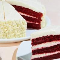 Whole Red Velvet Cake · Frosted with hand-whipped vanilla bean cream cheese and white chocolate curls.  12 Slices.