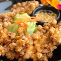 Corn Fritters (Gluten Free) · Lightly battered fresh cut sweet corn, deep fried served with sweet chili sauce. Gluten Free