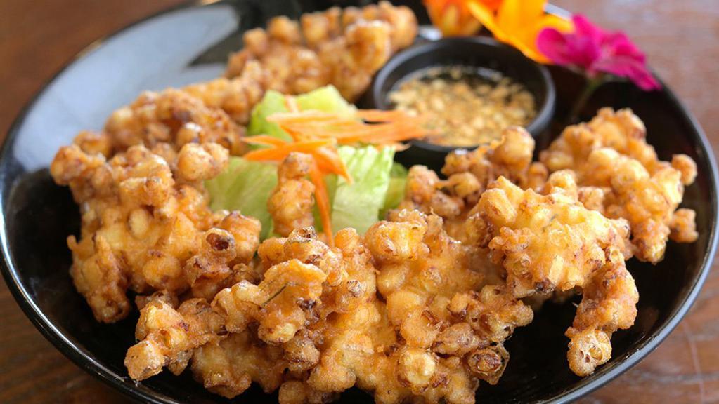 Corn Fritters (Gluten Free) · Lightly battered fresh cut sweet corn, deep fried served with sweet chili sauce. Gluten Free