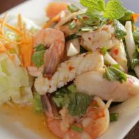 Seafood Salad (gluten free) · Prawns, fish and calamari with tomato, onion, shredded carrot, green onion and thai lime dre...