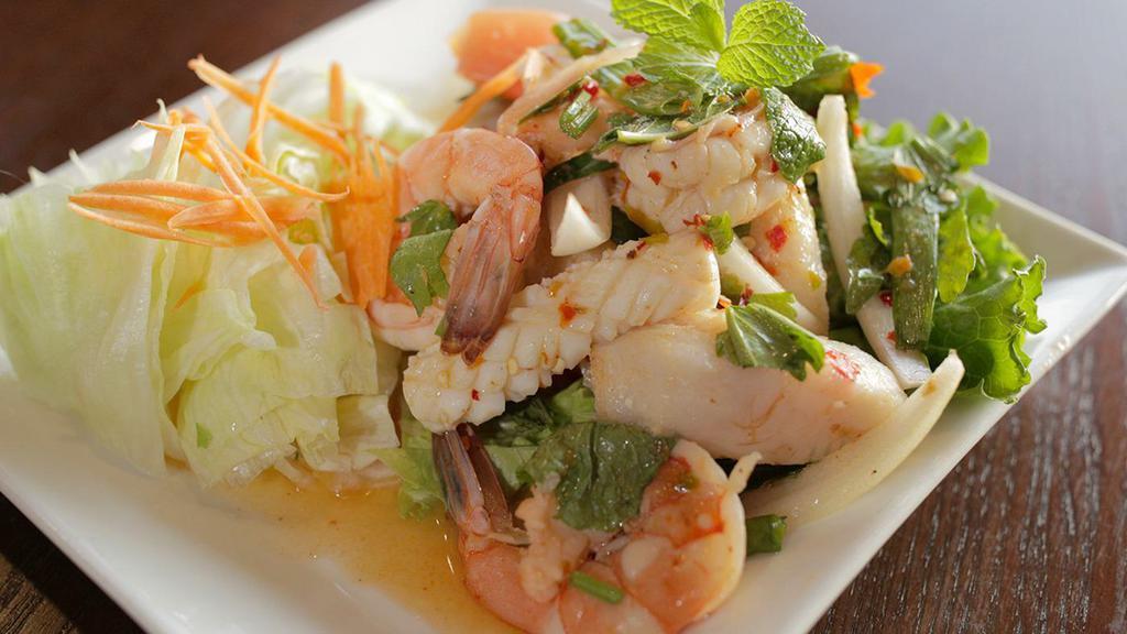 Seafood Salad (gluten free) · Prawns, fish and calamari with tomato, onion, shredded carrot, green onion and thai lime dressing.