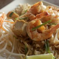 Pad Thai · Pan-fried rice noodles with egg, bean sprouts, chives and  grounded peanut with choice of ch...