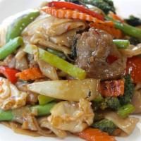 Pad Kee Mao · Pan-fried flat rice noodles with broccoli, tomato, onion, bell pepper, carrot, thai basil an...
