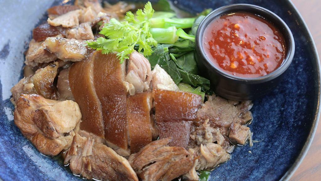 Braised Pork Leg ขาหมู (Entrée size doesn't come with rice) · Slow-cooked, savory pork leg, stewed with thai spices, served with chinese broccoli and dipping sauce.