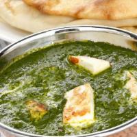 SAAG PANEER · Fresh spinach cooked with herbs and spices with homemade cheese cubes.
