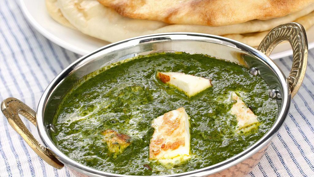 SAAG PANEER · Fresh spinach cooked with herbs and spices with homemade cheese cubes.