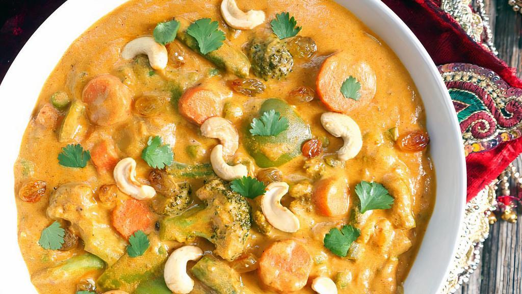 NAVRATAN KORMA · Fresh cut vegetable cooked with creamy sauce almonds, nuts and raisins.
