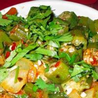 BHINDI BHAJI · Fresh cut okra cooked with chopped onions, tomatoes and spices.