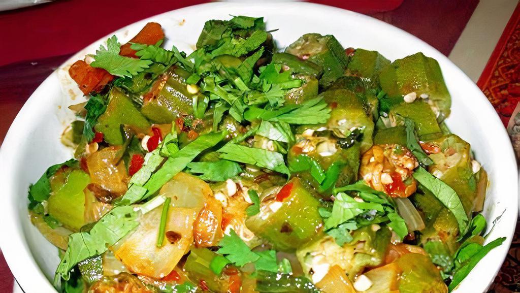 BHINDI BHAJI · Fresh cut okra cooked with chopped onions, tomatoes and spices.